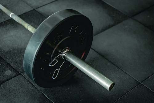 working out black barbell fitness